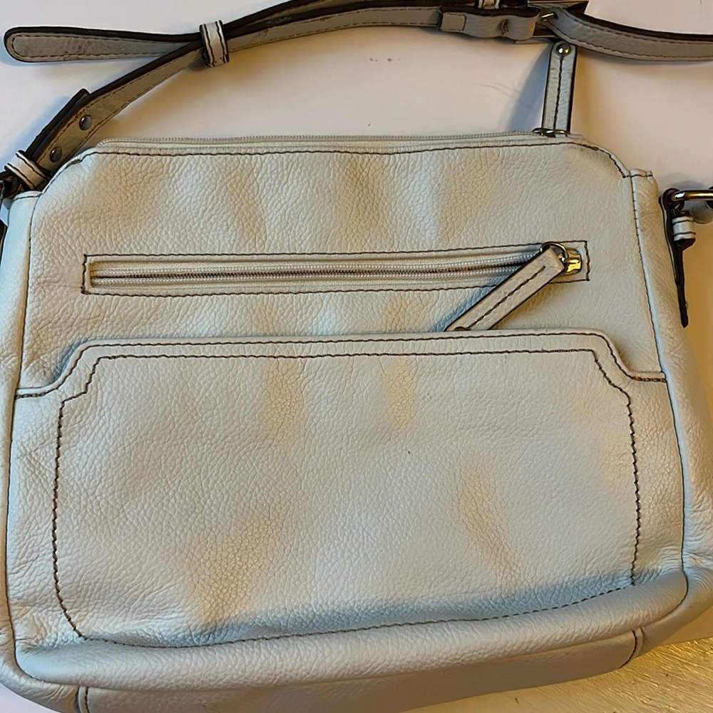 Tignanello crossbody bag . Pebbled leather winter white in color.